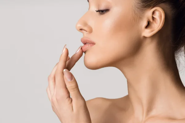 Woman modeling with finger on bottom lip