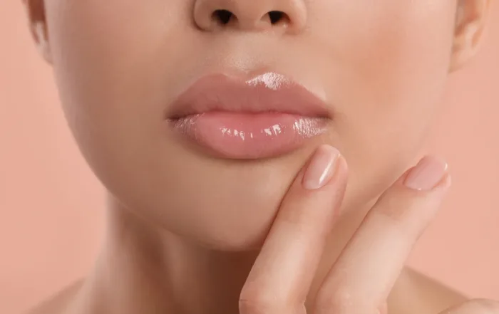 Close up of woman's face with shiny lips